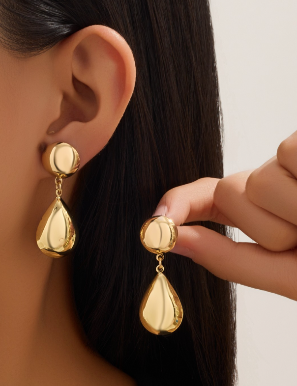 Gold Puffy Teardrop Earrings On Ear